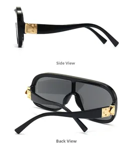 Details der schwarzen Sonnenbrille mit goldenem Metallscharnier und Nietendetails