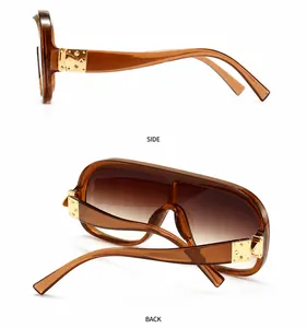 Detaillierte Seiten- und Rückansicht der bernsteinfarbenen Oversize-Sonnenbrille
