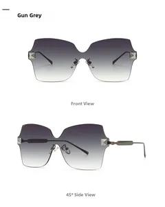 Detail van randloze oversized zonnebril in gun grey met verloopglazen en fonkelende accenten