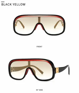 Detail einer Oversized-Flattop-Sonnenbrille mit gelben Verlaufsgläsern und Seitenstreifen