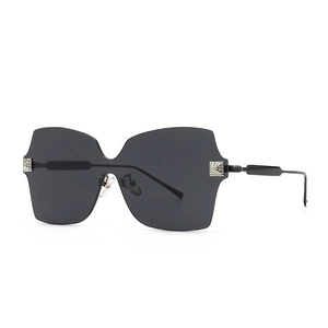 Chique oversized randloze zonnebril met strass-metalen accenten en zwarte glazen