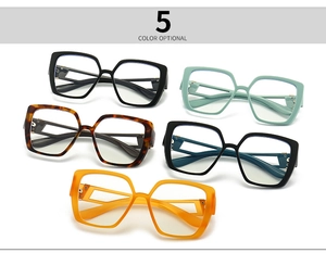 Five assorted colors of vintage cat-eye blue light blocking glasses shown on white background