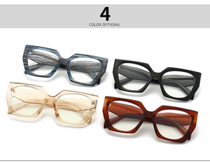 Macro detail of four retro square eyeglass frames in blue wood, black, tea, and tortoise