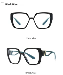 Detail of retro cat-eye glasses with black and blue dual-color frames and gold hinges