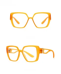 Front and 45-degree side view of orange cat-eye glasses with gold metal accents