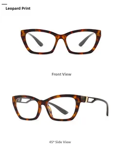 Detail of tortoise shell cat-eye glasses with gold metal accents and narrow frame