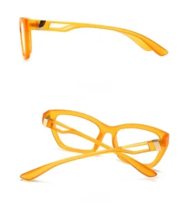Detail view of orange transparent glasses with hollow geometric temples and gold metal