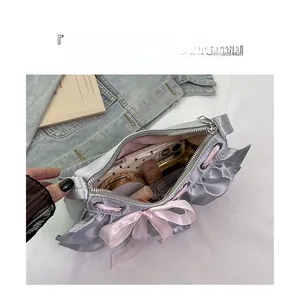 Detail view of silver tote bag interior showing large capacity and organized storage
