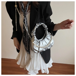 Silver metallic cloud handbag detail with pleats, pearl strap and fine gold chain