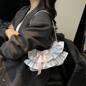 Metallic silver ruffled tote bag with pink bow ribbon and pleated designer style