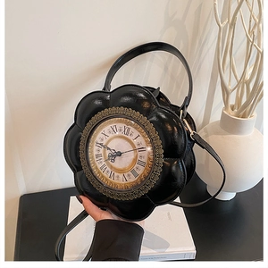 Detail view of a vintage clock-shaped handbag with Roman numerals and petal edges