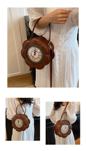 Detail of vintage flower-shaped clock handbag with Roman numerals and brown leather strap