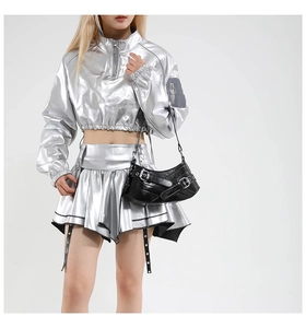 Close-up of a silver metallic motorcycle style underarm bag with decorative metal buckle