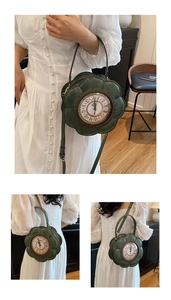 Close-up of a retro dark green flower-shaped handbag featuring a vintage clock dial design
