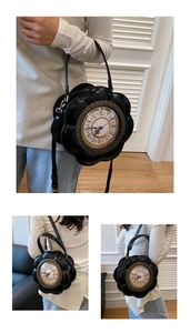 Macro detail of a vintage black clock handbag with Roman numerals and petal edges