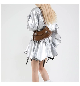 Detail of a brown leather shoulder bag featuring vintage silver metal buckles and straps