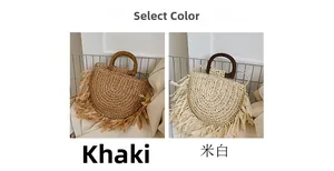 Detail of woven straw handbags with long tassels and circular wooden handles in khaki and white