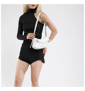 Close-up of white crescent shoulder bag with silver metallic buckle and eyelet details