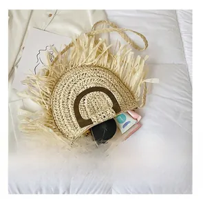 Detail presentation of straw shoulder bag capacity with makeup and phone inside