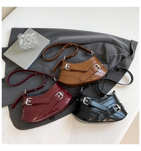 Chic trio of irregular curved shoulder bags in burgundy, brown and black with silver buckles