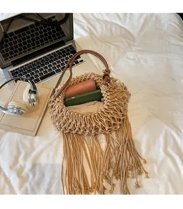 Detail of bohemian hand-woven mesh bag showing large capacity for phone and wallet