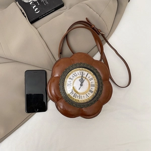 Vintage clock-shaped crossbody bag in dark caramel PU leather with retro metal dial detail
