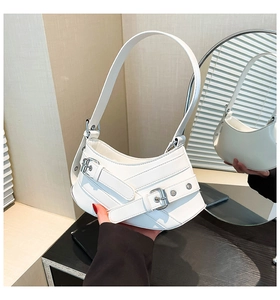 Detail of white half-moon shoulder bag with silver buckles and polished finish