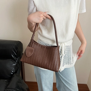 Deep brown woven leather shoulder bag with a minimalist design and matching strap
