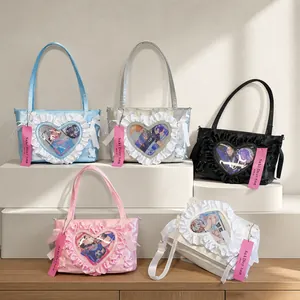 Detail showing colorful itabags with heart-shaped clear windows and ruffled silk textures