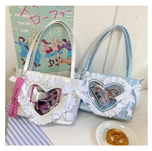 Close-up of frilly heart itabag with satin ribbons and clear window for anime pins