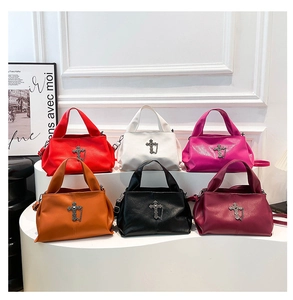 Detail view of colorful cross tote bags in lychee textured leather showing six vibrant colors