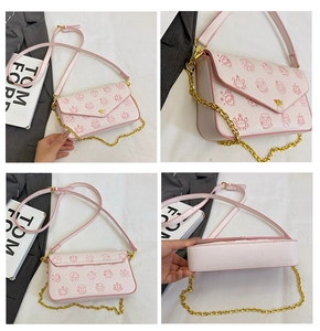 Detailed views of pink crossbody bag with leather texture and cartoon pattern prints