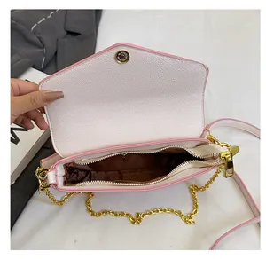 Internal view of crossbody bag showing organized space and zipper inner pocket