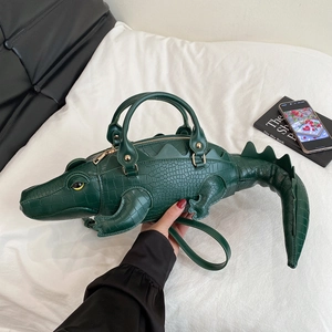 Creative dark green crocodile shaped handbag with realistic texture and strap