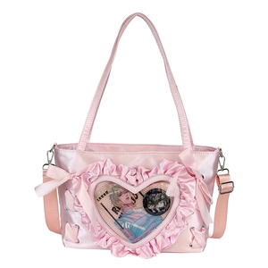 Pink satin ita bag with heart-shaped clear window and sweet ruffle bow decorations