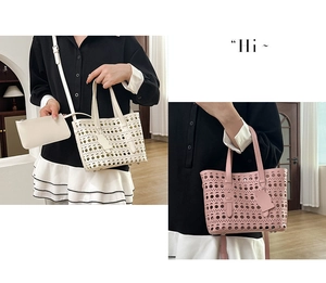 Detail of laser-cut hollow tote bag with detachable strap and cute cat charm pendant