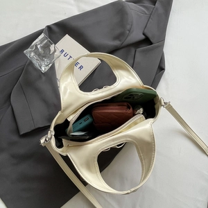 Creamy white tote bag with hollow handles and interior storage for daily essentials