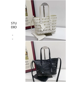 Detail of laser-cut hollow geometric tote bags with matching inner pouch and shoulder strap