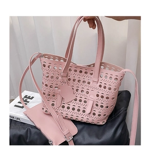 Pink laser-cut hollow tote bag set with inner pouch and adjustable shoulder strap