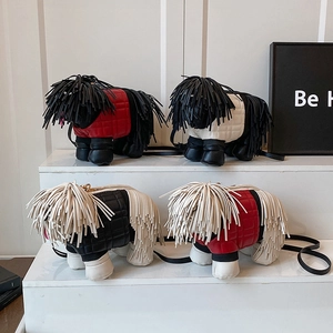 Unique dog-shaped crossbody bag with fringe details and quilted leather texture