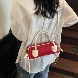 Fashionable red and white baguette bag with a minimalist rectangular design and top handles