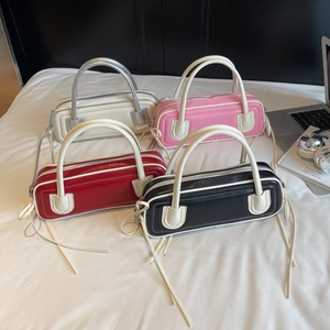 Minimalist leather baguette bags in four colors with long fringe zipper detail
