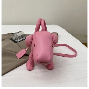 Top view of creative pink dog-shaped handbag with adjustable shoulder strap