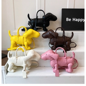 Detailed view of creative puppy-shaped handbags in five colors with long shoulder straps