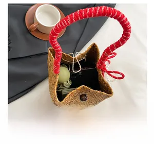 Internal view of handmade straw tote showing storage capacity for phone and umbrella