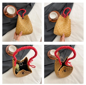 Detailed macro view of woven bucket bag featuring red and white spiral cord handle