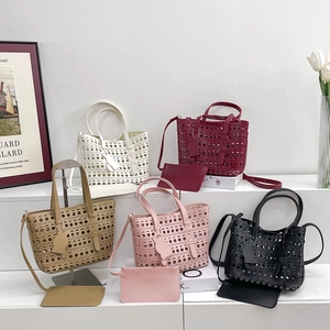 Hollow out leather tote bags in five colors with matching inner pouches and shoulder straps