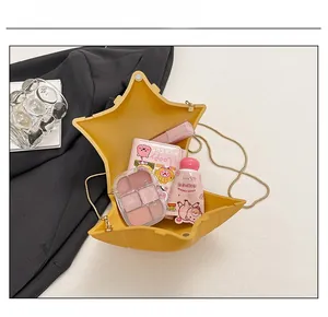 Internal view of star-shaped chain bag showing space for makeup and essentials