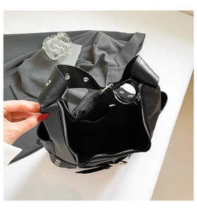 Internal view of a black motorcycle-style tote bag with large main compartment and zipper pocket