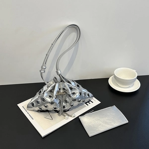 Silver studded bucket bag with metallic grommets, pearl drawstring and matching card pouch